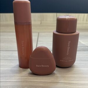 Rare Beauty Nude Rose body lotion, travel size lotion and body/hair spray.